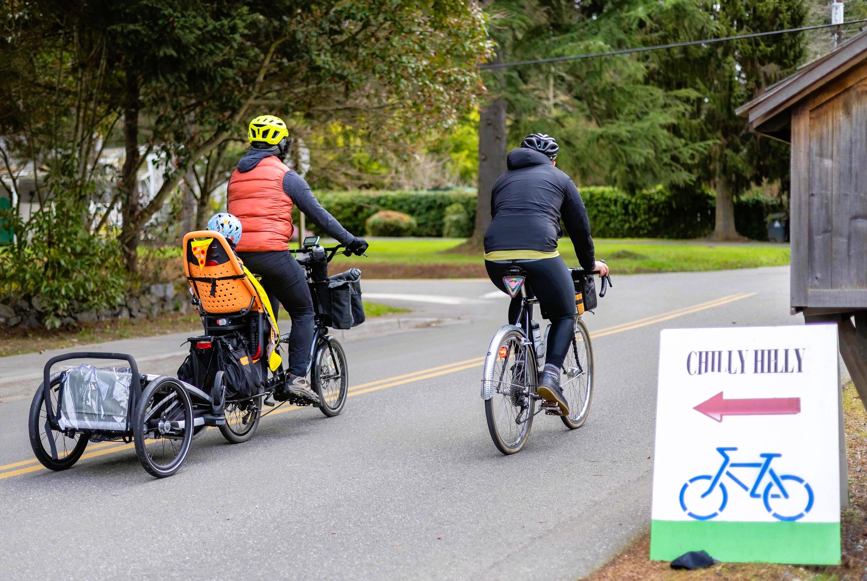 Parents on e-bikes often pull their kids on Chilly Hilly