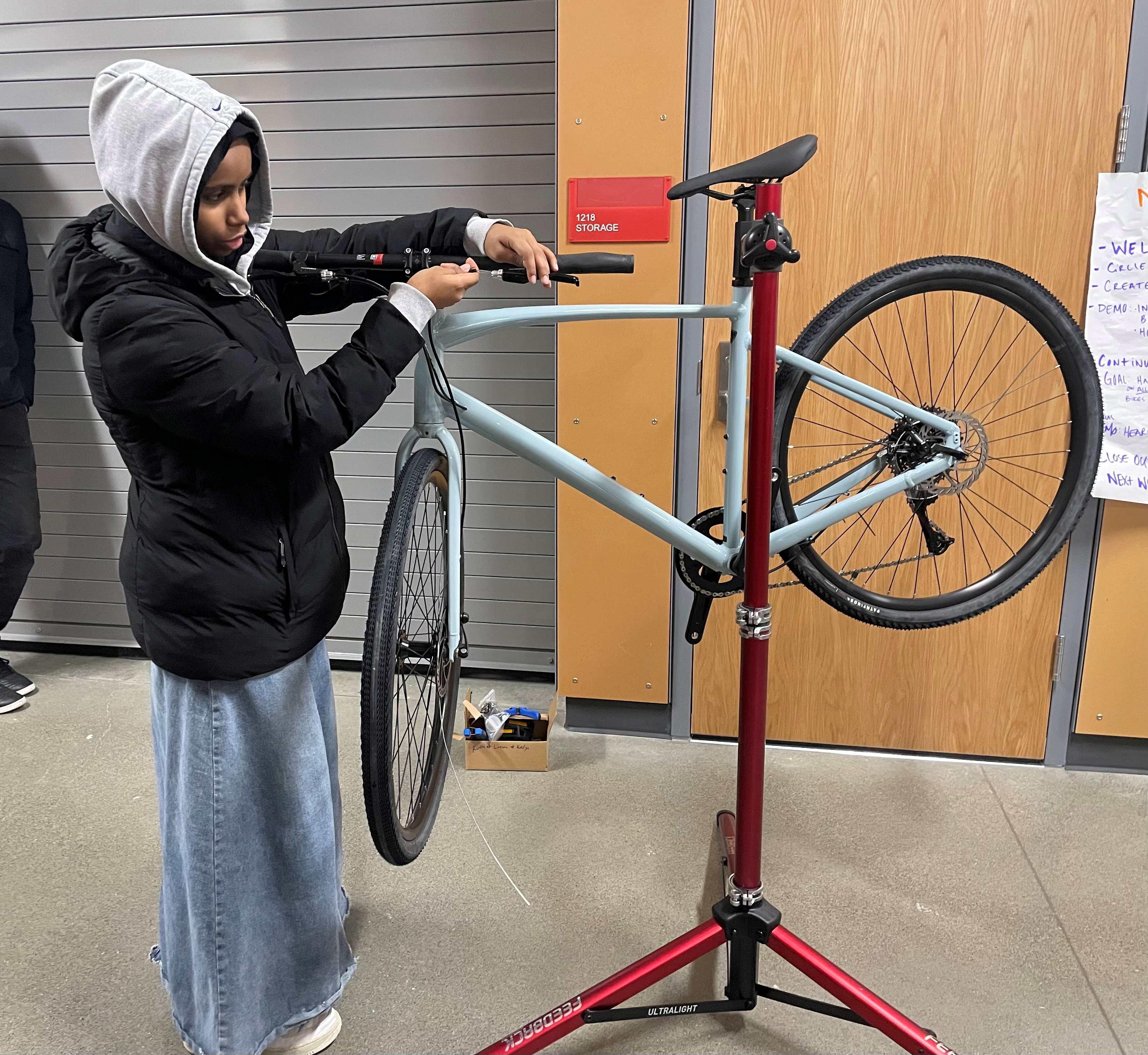 Khedija fixing a bike