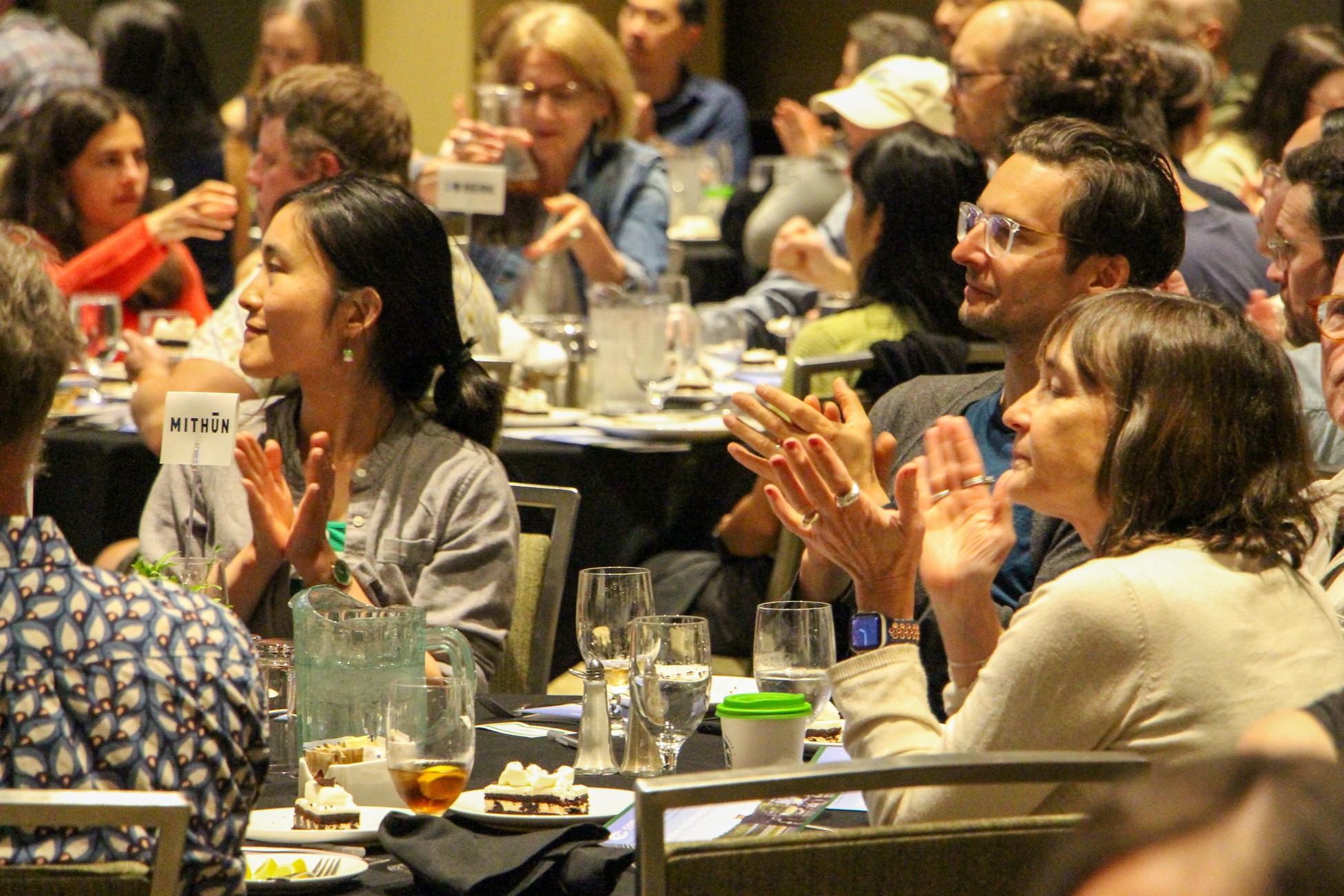 Audience members applaud at the Bike Everywhere Lunch