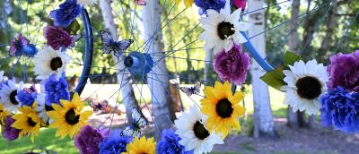 Painted bicycle wheels with flowers attached