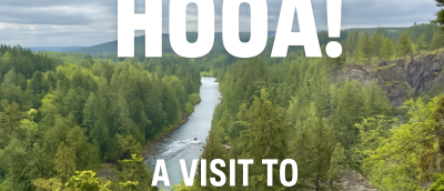 Snoqualmie River with evergreen forest flanking it. The text HOOA! A Visit to Snoqualmie Falls