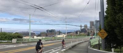 Cyclists riding over the Jose Rizal Bridge's new protected bike lanes