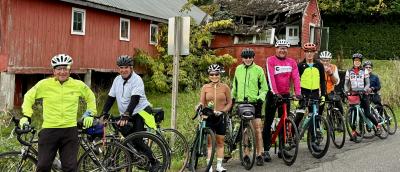 Cyclists I. Front of red barn
