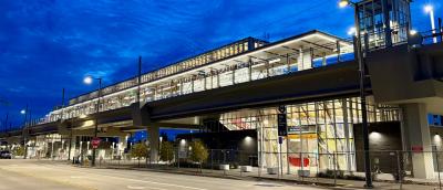 Night view of the elevated Kent Des Moines light rail station all lit up before it officially opens