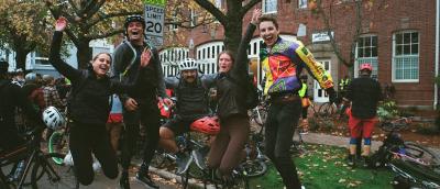 Cranksgiving participants leaping in the air