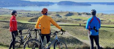 bikers in colorful jackets admiring the view at chambers bay golf course