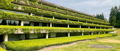 Lush greenery coats the side of the old Weyerhaeuser Corporate Headquarters building