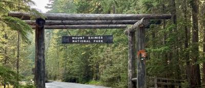 A photo of the gateway entrance to Mount Rainier National Park in the forest. 