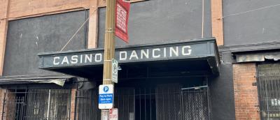 Old awning sticking out from a brick building that has the words Casino Dancing referring to one of the oldest gay friendly bars in the country