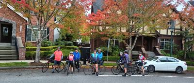 Cyclists with fall trees
