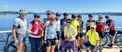 group of cyclists by the water