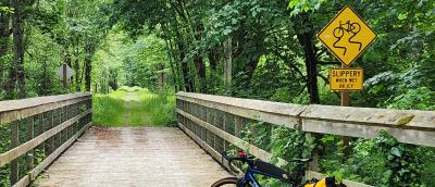 Bike on gravel near bridge