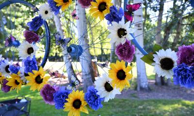 Painted bicycle wheels with flowers attached
