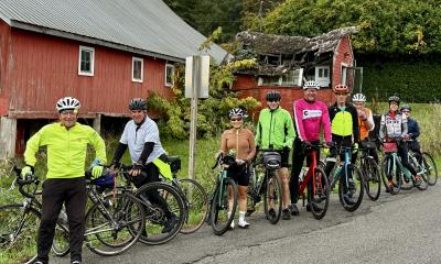 Cyclists I. Front of red barn