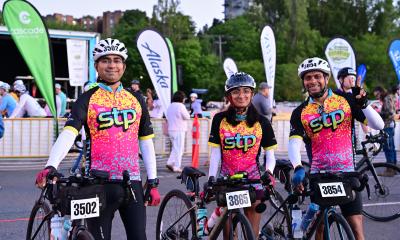 STP riders in 2025 show off the vivacious pink jersey