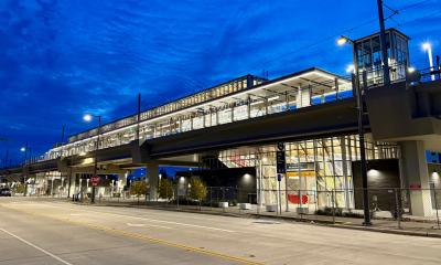 Night view of the elevated Kent Des Moines light rail station all lit up before it officially opens