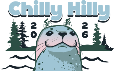 A harbor seal pops its head above gentle waves.