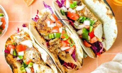 Photo of three chicken tacos