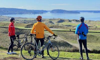 bikers in colorful jackets admiring the view at chambers bay golf course