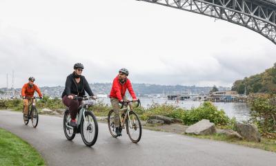 Happy cyclists riding around Lake Union on the Burke-Gilman Trail