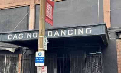 Old awning sticking out from a brick building that has the words Casino Dancing referring to one of the oldest gay friendly bars in the country