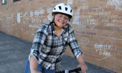 A Mount Vernon teen smiles while biking