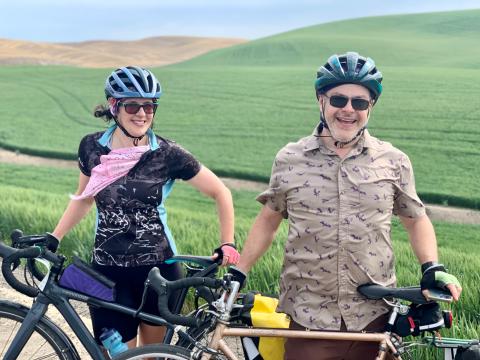 People smile while riding in hte Walla Walla Tour.