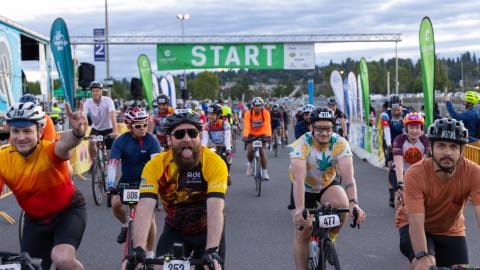 Excited riders at the start line of the STP 2025 ride